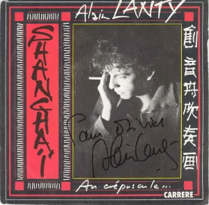 1986,
45 tours,
"Shanghaï au crépuscule" / "Aigues marine",
dédicacé à Marche-en Famenne ce 1/03/2003.